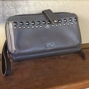 The Sak gray wallet silver hardware trim wristlet